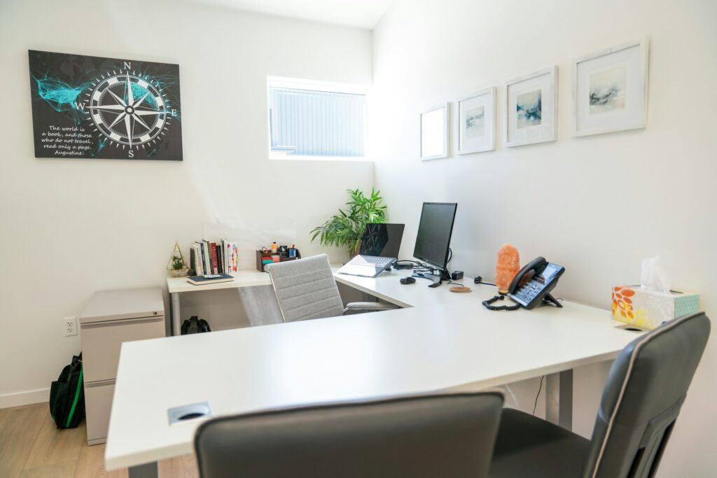 Modern office space setup with a desk, computer, and decor, ideal for businesses searching for office space for lease near me.