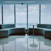 Modern office space for lease near me with stylish furniture, large table, and chairs in a bright, professional setting.