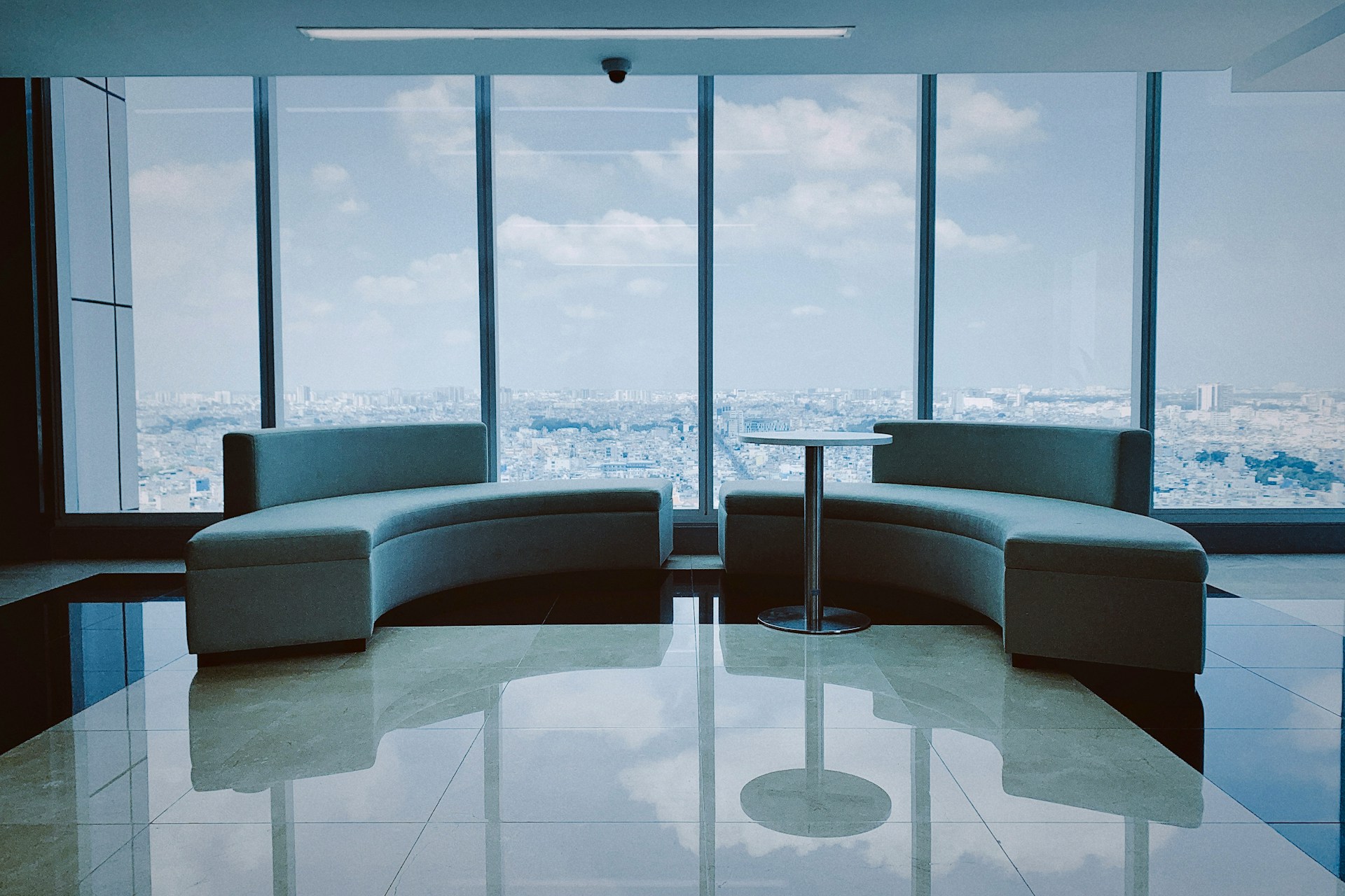 Modern office space for lease near me with stylish furniture, large table, and chairs in a bright, professional setting.
