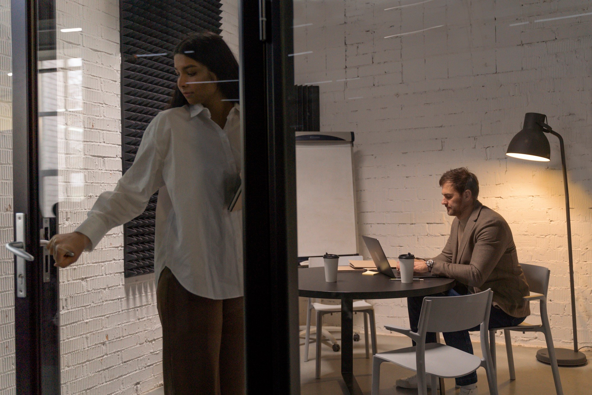 Business owner working on strategy in a modern office space for lease in a hybrid work era.