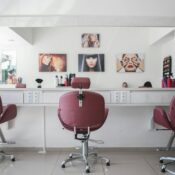 Modern beauty salon interior with styling chairs, mirrors, and bright lighting, ideal setup for professionals seeking a beauty salon space for lease.