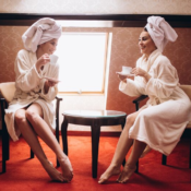 luxury restaurant interior with two women relaxing and drinking coffee